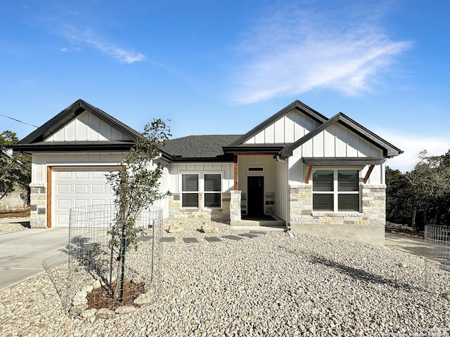 1229 Marlys, Canyon Lake, TX 78133 - view of front of property featuring board and batten siding, concrete driveway, a garage, and stone siding