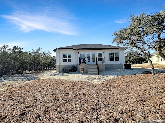 1229 Marlys, Canyon Lake, TX 78133 - view of front of home featuring french doors and board and batten siding
