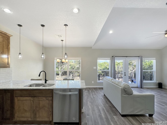 1229 Marlys, Canyon Lake, TX 78133 - kitchen with dishwasher, a sink, open floor plan, dark wood-style floors, and a peninsula