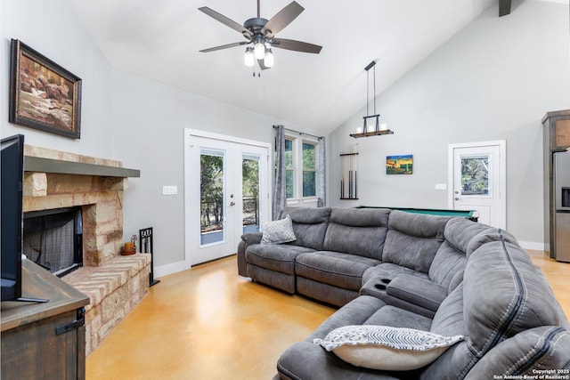 868 Lakeridge Loop, Lakehills, TX 78063 - living area with baseboards, a ceiling fan, high vaulted ceiling, finished concrete flooring, and a stone fireplace