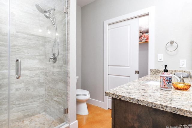 868 Lakeridge Loop, Lakehills, TX 78063 - full bathroom featuring vanity, toilet, a stall shower, and baseboards
