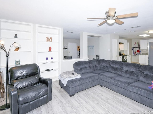 9730 Ivy Plain Dr, San Antonio, TX 78245 - living room with light wood-style flooring and ceiling fan