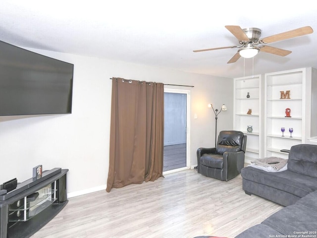 9730 Ivy Plain Dr, San Antonio, TX 78245 - living room featuring wood finished floors, baseboards, and ceiling fan