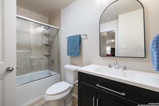 12162 Remilly Way, Schertz, TX 78154 - full bath featuring vanity, toilet, combined bath / shower with glass door, and wood finished floors