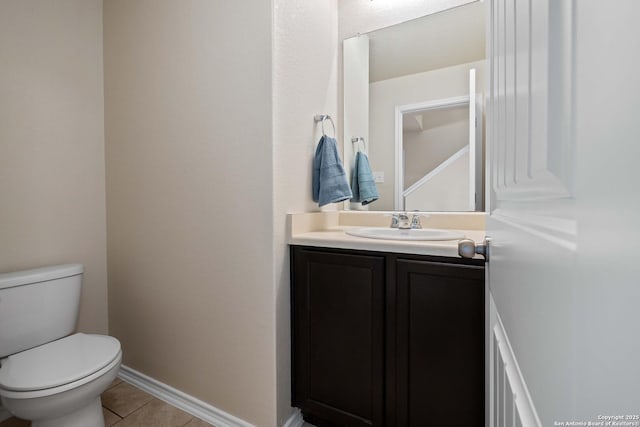 12162 Remilly Way, Schertz, TX 78154 - half bathroom featuring toilet, vanity, tile patterned flooring, and baseboards