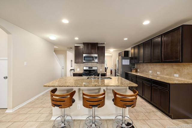 12162 Remilly Way, Schertz, TX 78154 - kitchen featuring stainless steel appliances, arched walkways, a sink, backsplash, and recessed lighting