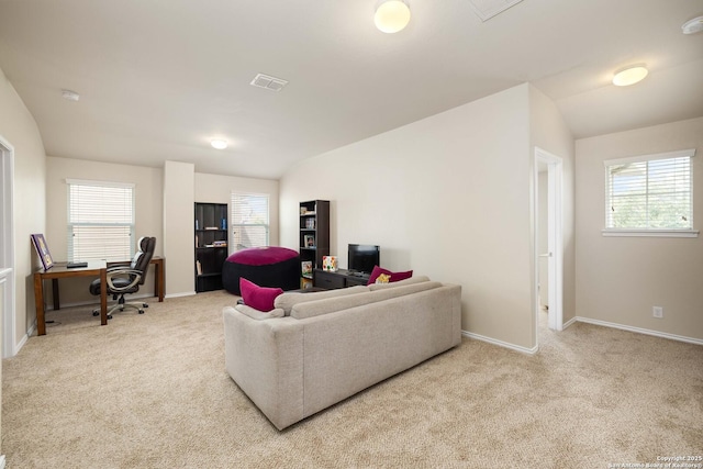 12162 Remilly Way, Schertz, TX 78154 - carpeted living area with a desk, plenty of natural light, vaulted ceiling, and baseboards