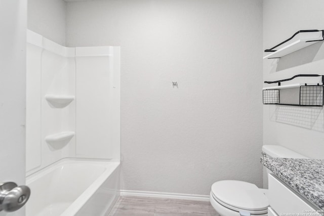 2781 Rosefinch, New Braunfels, TX 78130 - full bathroom featuring vanity, baseboards, toilet, wood finished floors, and shower / tub combination