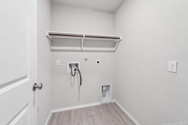 2781 Rosefinch, New Braunfels, TX 78130 - washroom featuring hookup for a gas dryer, hookup for an electric dryer, washer hookup, light wood-style floors, and baseboards