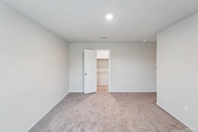 2781 Rosefinch, New Braunfels, TX 78130 - unfurnished bedroom featuring light colored carpet, a spacious closet, and baseboards
