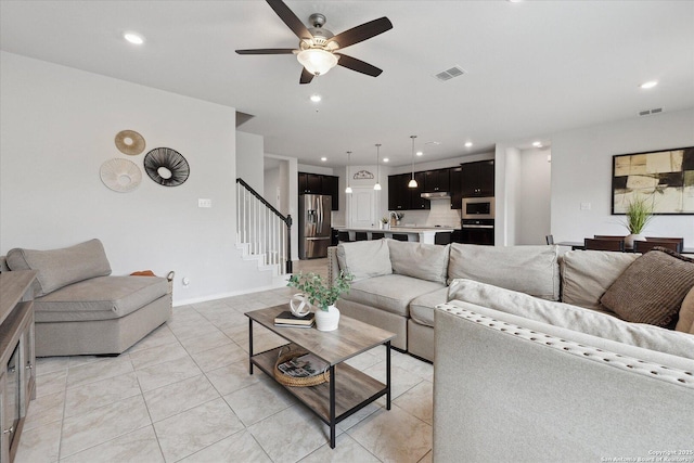 14607 Flatiron Clf, San Antonio, TX 78253 - living area featuring stairway, a ceiling fan, recessed lighting, light tile patterned flooring, and baseboards