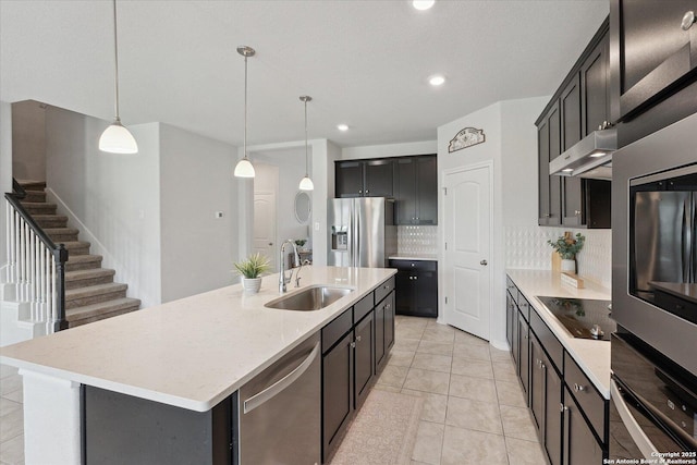 14607 Flatiron Clf, San Antonio, TX 78253 - kitchen featuring appliances with stainless steel finishes, a sink, ventilation hood, decorative backsplash, and hanging light fixtures