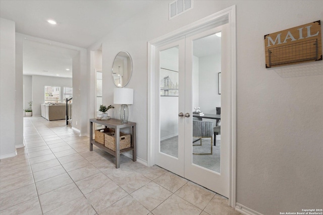 14607 Flatiron Clf, San Antonio, TX 78253 - hallway with french doors, light tile patterned floors, recessed lighting, and baseboards