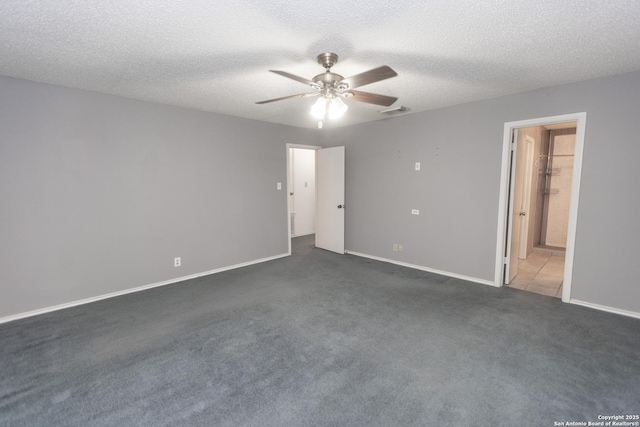 13043 Woller Crk, San Antonio, TX 78249 - unfurnished bedroom featuring carpet flooring, baseboards, ceiling fan, a textured ceiling, and ensuite bath