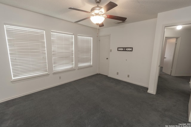 13043 Woller Crk, San Antonio, TX 78249 - unfurnished room with dark colored carpet, ceiling fan, and baseboards