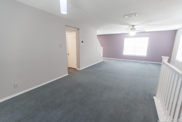 13043 Woller Crk, San Antonio, TX 78249 - empty room with ceiling fan, dark colored carpet, a textured ceiling, and baseboards