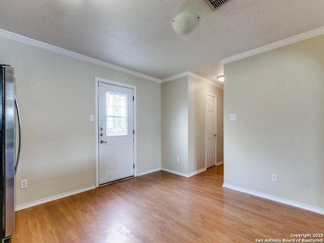 4622 Stallion Cv, San Antonio, TX 78244 - foyer with crown molding, light wood-type flooring, and baseboards