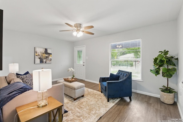 315 Morrill, San Antonio, TX 78214 - living room featuring wood finished floors, baseboards, and ceiling fan