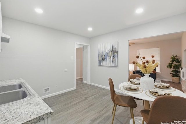 315 Morrill, San Antonio, TX 78214 - dining area with baseboards, light wood finished floors, and recessed lighting