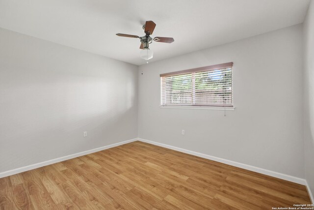 11519 Clifton Forge St, San Antonio, TX 78230 - empty room featuring baseboards, light wood-style flooring, and a ceiling fan