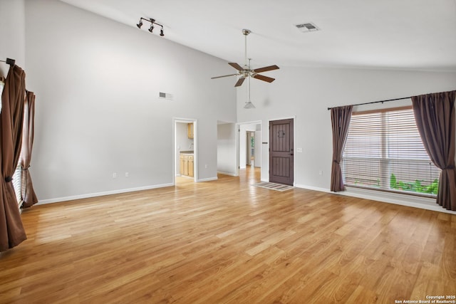 11519 Clifton Forge St, San Antonio, TX 78230 - unfurnished bedroom featuring baseboards, light wood-style floors, high vaulted ceiling, ceiling fan, and track lighting