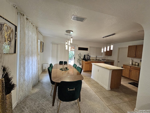10518 Staggering, San Antonio, TX 78254 - dining room featuring a textured ceiling and light tile patterned floors