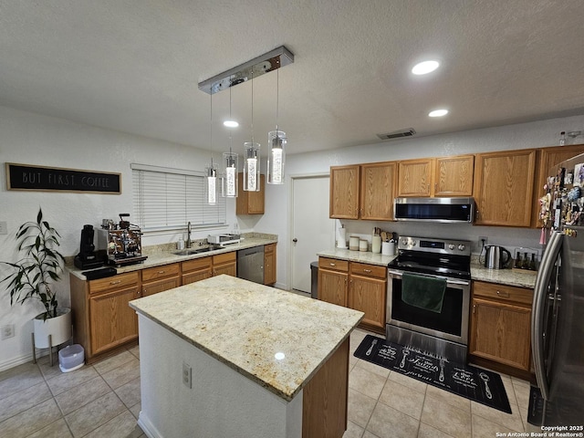 10518 Staggering, San Antonio, TX 78254 - kitchen featuring appliances with stainless steel finishes, a sink, brown cabinetry, a center island, and recessed lighting