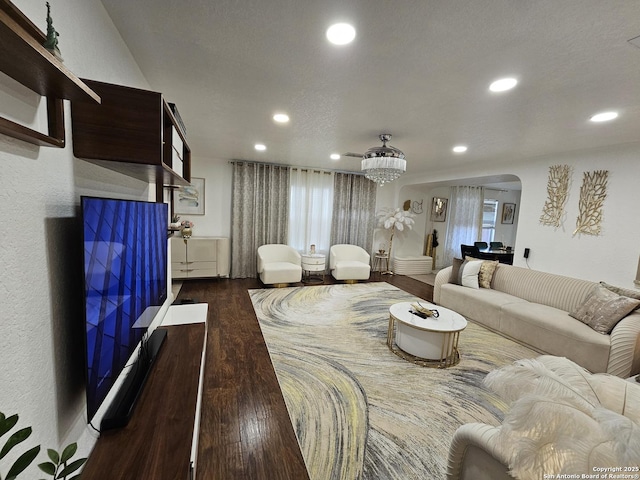 10518 Staggering, San Antonio, TX 78254 - living room featuring arched walkways, recessed lighting, dark wood-style flooring, and plenty of natural light