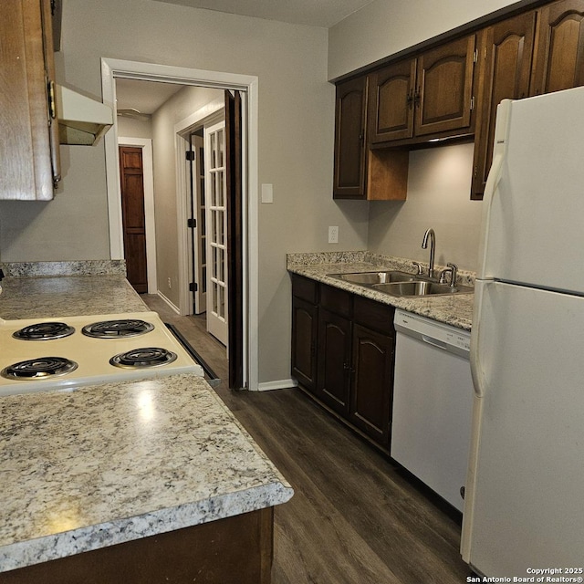 2915 Eisenhauer, San Antonio, TX 78209 - kitchen featuring white appliances, a sink, dark wood-type flooring, light countertops, and dark brown cabinets