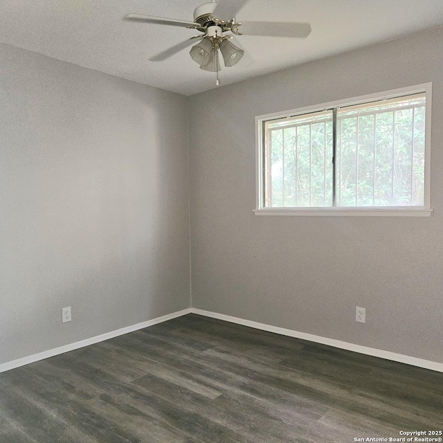 2915 Eisenhauer, San Antonio, TX 78209 - unfurnished room featuring a ceiling fan, dark wood-style flooring, and baseboards