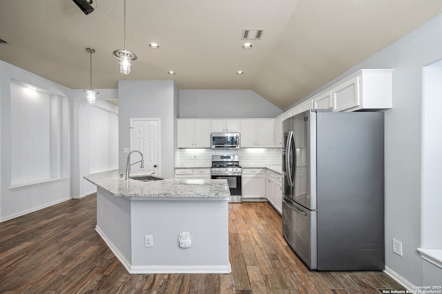 3615 Mill Mdw, San Antonio, TX 78247 - kitchen with stainless steel appliances, a sink, dark wood-type flooring, white cabinetry, and lofted ceiling
