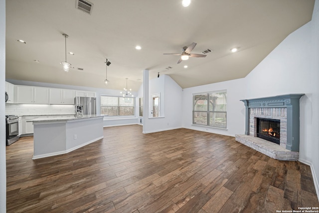 3615 Mill Mdw, San Antonio, TX 78247 - kitchen featuring appliances with stainless steel finishes, open floor plan, healthy amount of natural light, a ceiling fan, and lofted ceiling