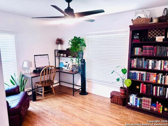703 Mcdougal, San Antonio, TX 78223 - home office featuring healthy amount of natural light, a ceiling fan, and wood finished floors