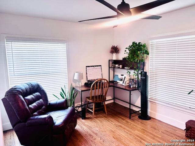 703 Mcdougal, San Antonio, TX 78223 - home office featuring light wood-style floors, ceiling fan, and baseboards