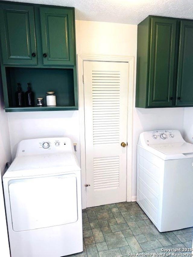 703 Mcdougal, San Antonio, TX 78223 - laundry area with cabinet space and washing machine and dryer
