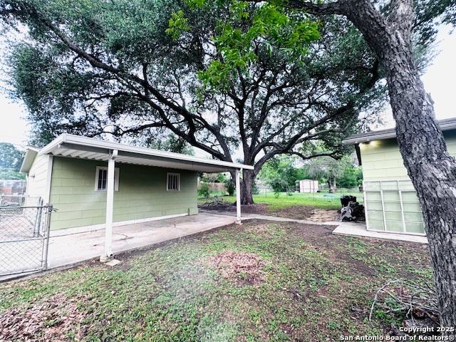 703 Mcdougal, San Antonio, TX 78223 - view of yard featuring a patio area