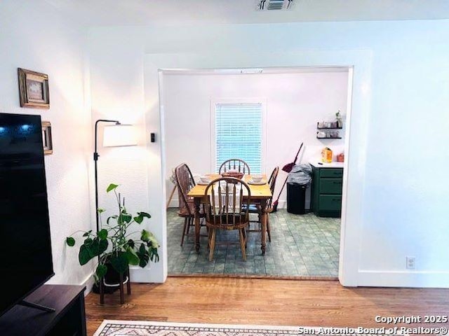 703 Mcdougal, San Antonio, TX 78223 - dining room with wood finished floors and baseboards