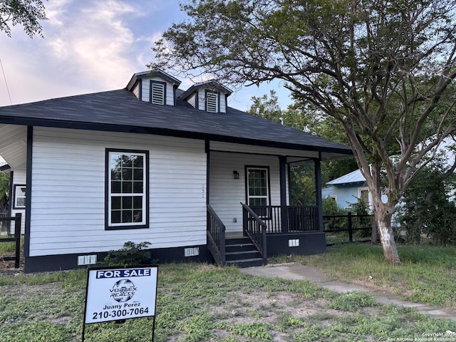 151 Cornell, San Antonio, TX 78201 - view of front of home with covered porch, crawl space, and a shingled roof