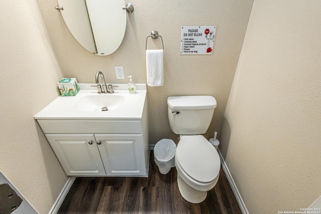 1202 N Center, San Antonio, TX 78202 - bathroom featuring wood finished floors, vanity, toilet, and baseboards