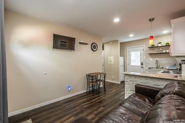 1202 N Center, San Antonio, TX 78202 - living area featuring dark wood-style floors, baseboards, recessed lighting, and a heating unit