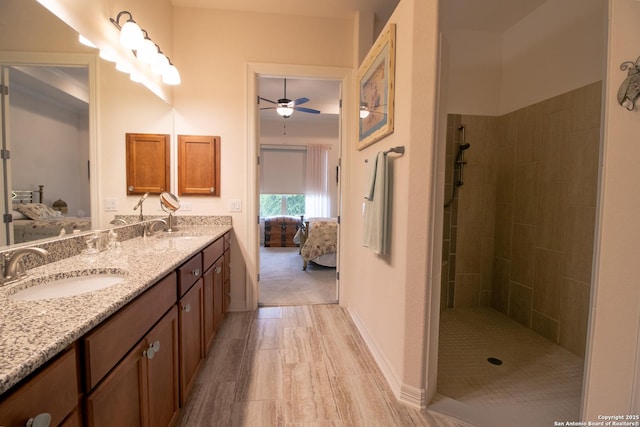 4634 Makayla Cross, San Antonio, TX 78261 - full bathroom featuring ensuite bath, double vanity, ceiling fan, tiled shower, and baseboards