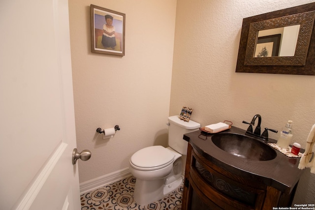 4634 Makayla Cross, San Antonio, TX 78261 - bathroom featuring toilet, vanity, and baseboards