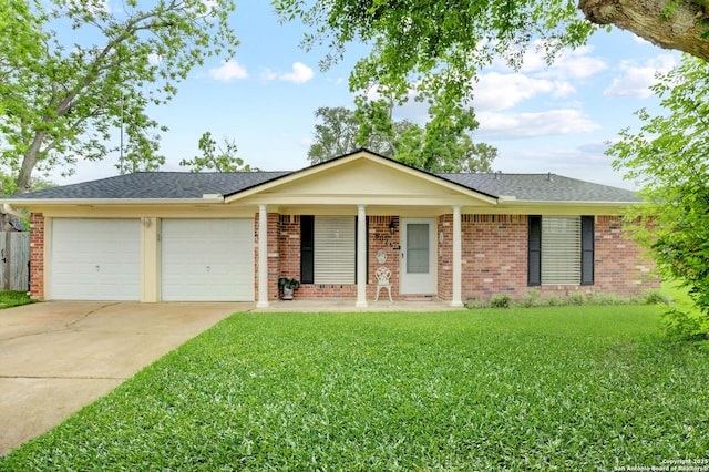 8026 Leigh, Hitchcock, TX 77563 - single story home with a garage, covered porch, a front yard, driveway, and brick siding