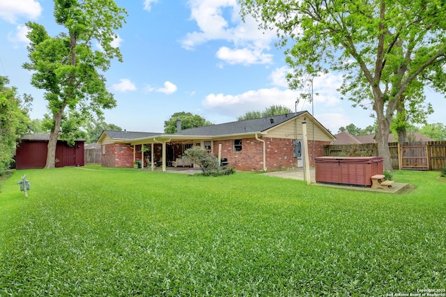 8026 Leigh, Hitchcock, TX 77563 - back of property featuring a hot tub, a patio, and brick siding