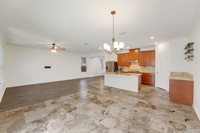 5245 Nature Path, Schertz, TX 78154 - kitchen featuring a chandelier, stainless steel fridge with ice dispenser, open floor plan, a ceiling fan, and brown cabinetry