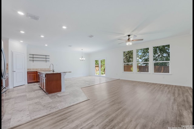 5245 Nature Path, Schertz, TX 78154 - kitchen with open floor plan, a ceiling fan, a chandelier, an island with sink, and recessed lighting