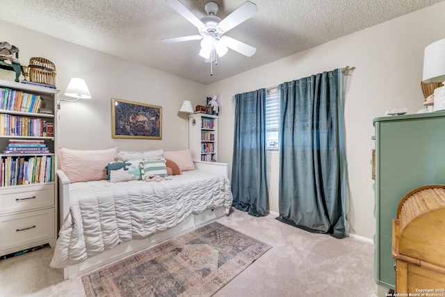 9515 Wicklow, San Antonio, TX 78250 - carpeted bedroom featuring a textured ceiling and a ceiling fan