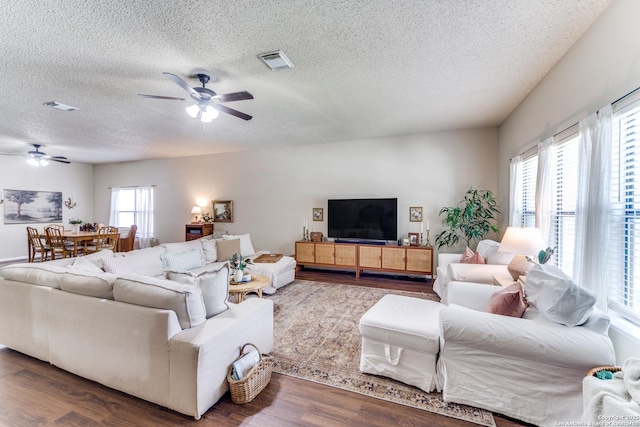 9515 Wicklow, San Antonio, TX 78250 - living area with ceiling fan, a textured ceiling, and wood finished floors