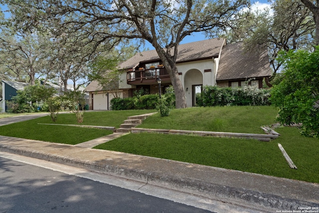 2822 Low Oak, San Antonio, TX 78232 - view of front facade featuring stucco siding, a front lawn, driveway, a balcony, and roof with shingles