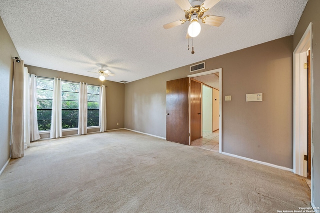 2822 Low Oak, San Antonio, TX 78232 - unfurnished bedroom featuring a textured ceiling, light carpet, baseboards, and a ceiling fan